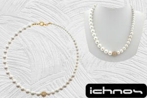 Collana perle assimetrica con sfera zirconi dorata e chiusura acciaio