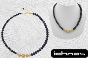 Collana assimetrica cristallo e onice nero con centrale sfere zirconi e chiusura acciaio dorate