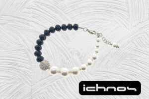 Bracciale asimmetrico perle e cristalli con chiusura acciaio, pallina strass e catenina di regolazione