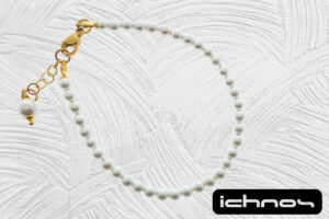 Bracciale perle mm. 4 con chiusura acciaio e catenina di regolazione dorate